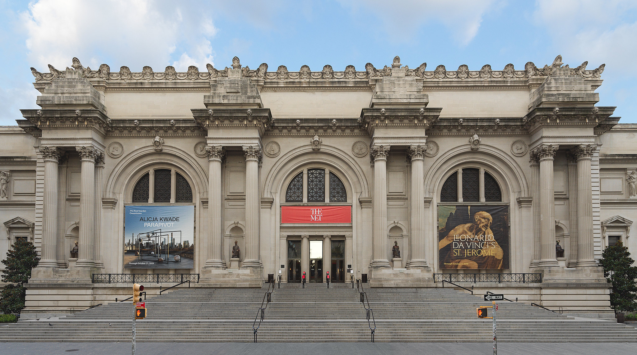 a view of the front entrance of the Metropolitan Museum of Art as seen from Fifth Avenue