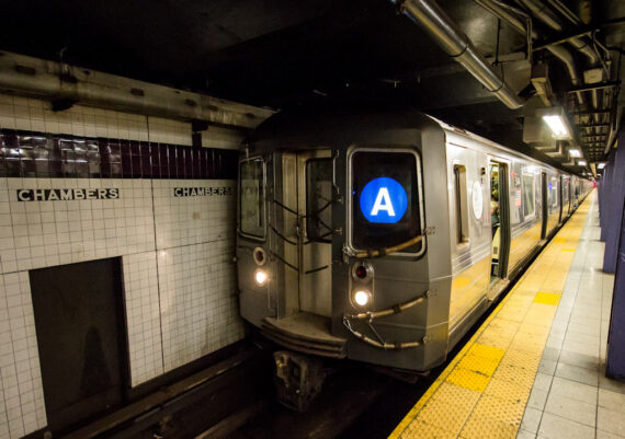 A train arriving at the Chambers Street station