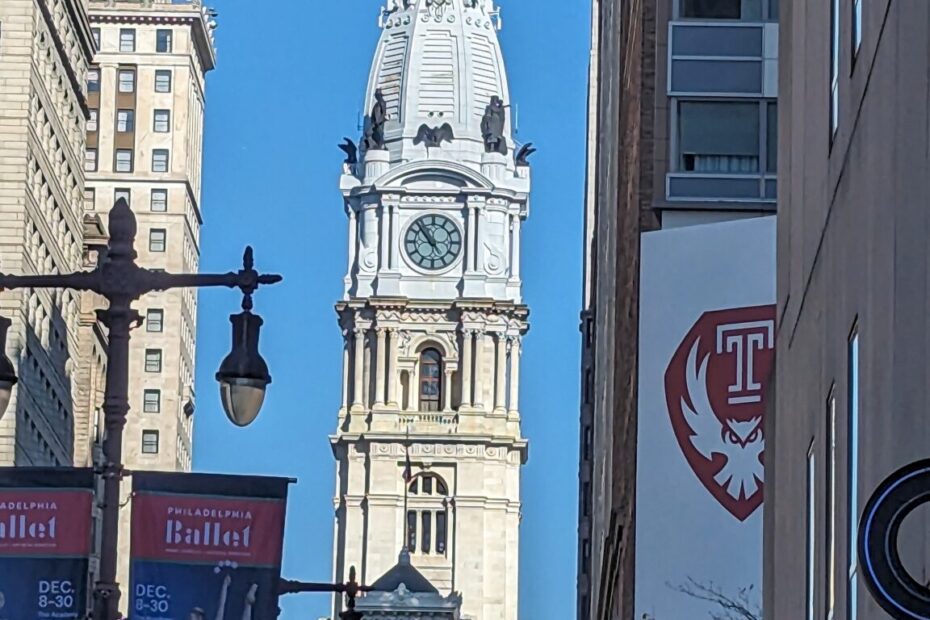 a photo of a street in Philadephia with the view of City Hall.