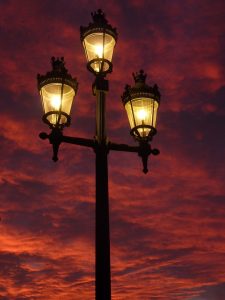 Street lanterns against red sky