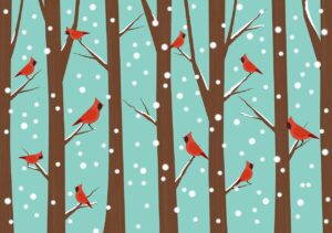 Red cardinals on brown trees with snow-spotted blue background