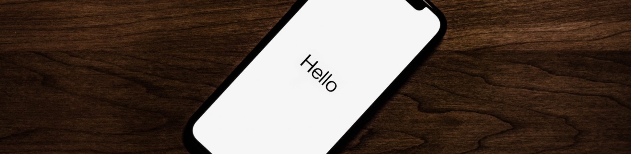 IPhone with white screen and just the word hello on it