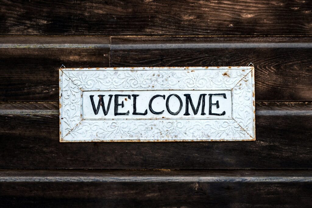 photo of welcome sign on wood panels