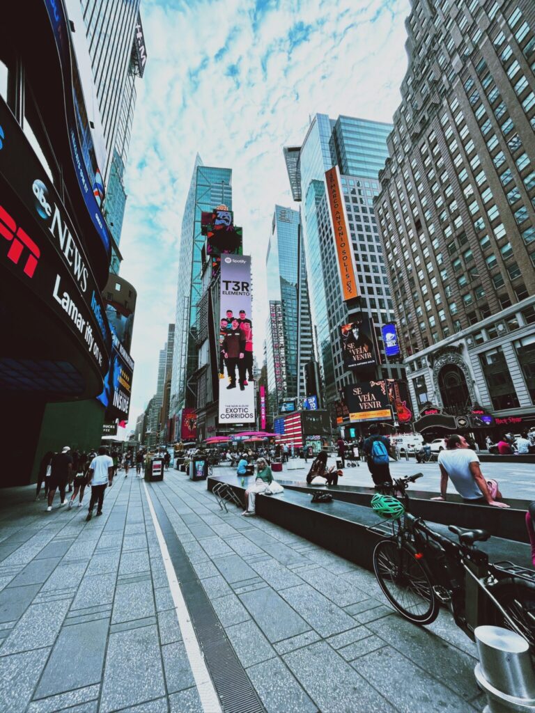 Photo by Nicolas Postiglioni: https://www.pexels.com/photo/people-sitting-on-the-benches-in-time-square-9559782/